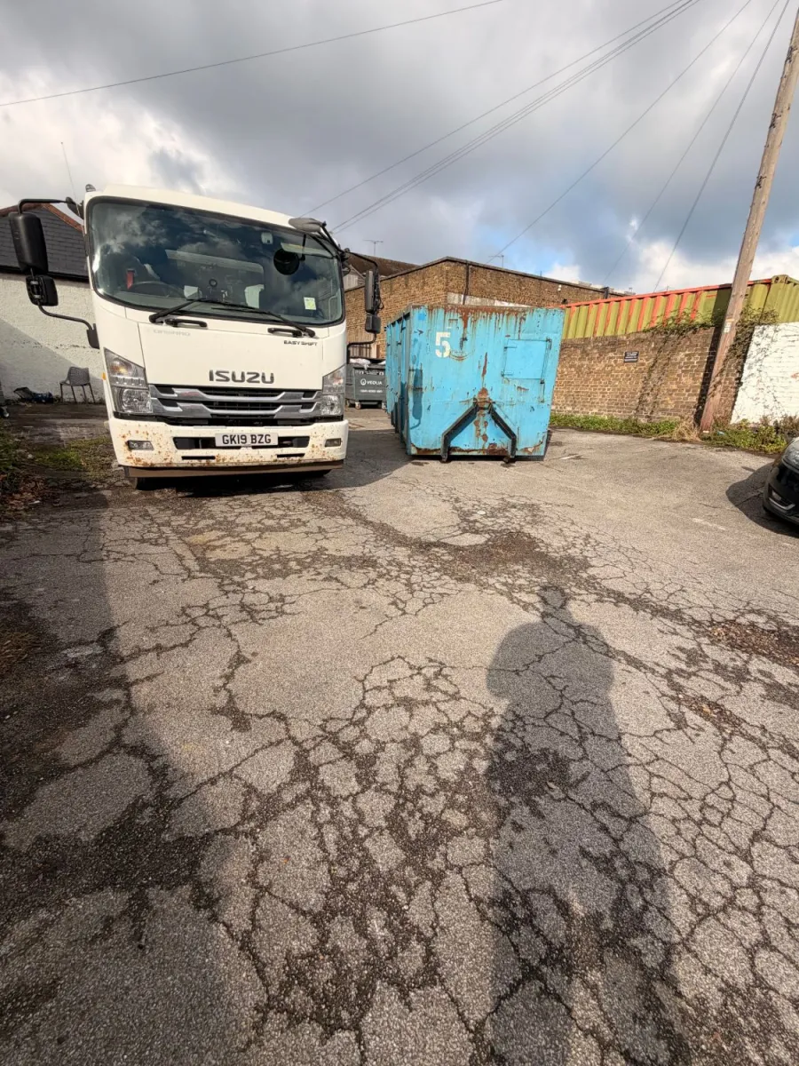Our hook lorry and a roll-on container in a customer’s yard