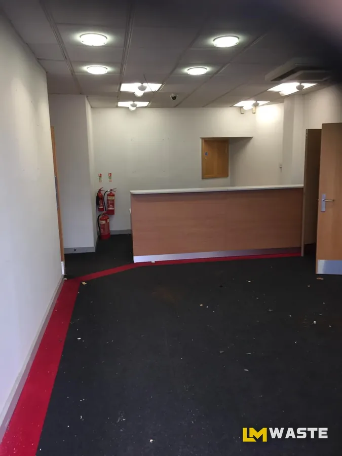 After: Office clearance: desks, cabinets and cabling out, room left swept